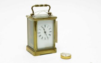 A 19th Century French brass carriage clock and a compass