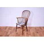 A 19th Century ash and elm comb back Windsor chair