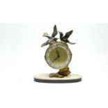 A French Art Deco style brass mantel clock