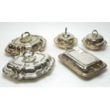 A pair of silver plated entree dishes and covers