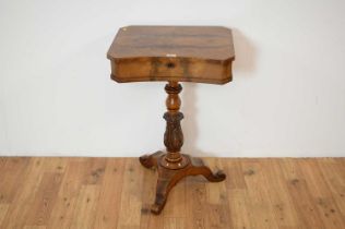 A 19th Century mahogany concave fronted work table