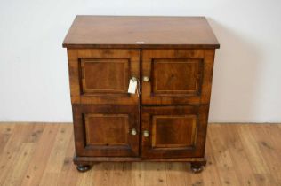 A two tier mahogany cupboard