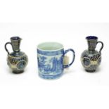 A pair of Doulton Lambeth stoneware ewers; and a mug