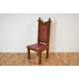 An early 20th Century gothic revival oak chairman/presidents chair