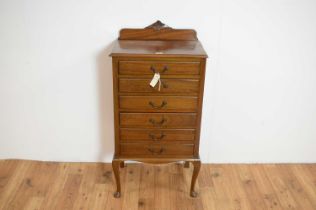 An Edwardian mahogany music cabinet