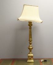 A pair of brass baluster lamps