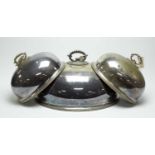 A set of three 19th Century silver plated dome covers; and a larger dome