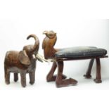 An Eastern carved wood camel stool