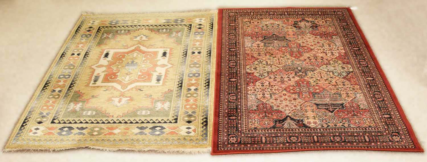 A 20th Century Persian style rug from John Lewis with another