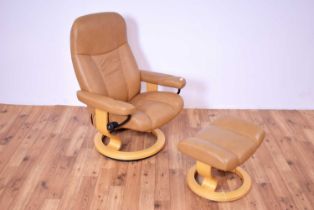 A contemporary Scandinavian Ekornes Stressless reclining armchair and matching ottoman