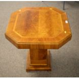 A crossbanded burr walnut Art Deco pedestal table