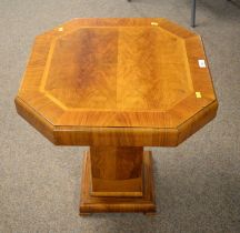 A crossbanded burr walnut Art Deco pedestal table