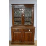 An early 20th Century Arts & Crafts style glazed bookcase