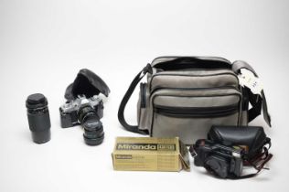 A collection of cameras and accessories
