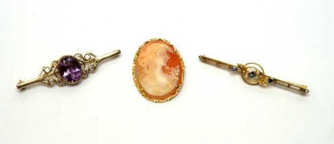 A selection of three gold brooches