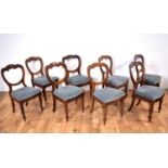 A set of eight Victorian balloon back dining chairs