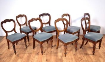 A set of eight Victorian balloon back dining chairs