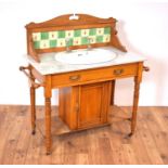 A late Victorian satin walnut marble wash stand