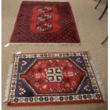 A vintage 20th Century Afghan Aqsha rug with another