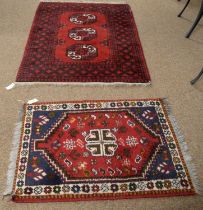 A vintage 20th Century Afghan Aqsha rug with another