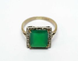 A green glass and diamond cluster dress ring