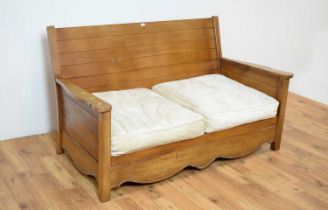 A contemporary hardwood sofa