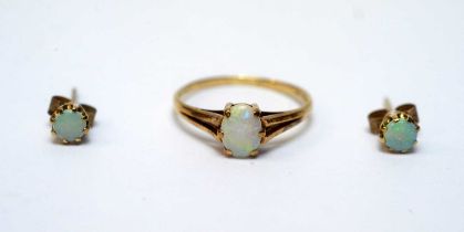 An opal ring; and a pair of opal earrings