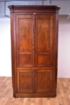 A large 19th Century mahogany floor standing corner cabinet