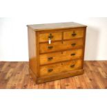 A late Victorian ash chest of drawers