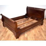 A modern mahogany 'lit en bateau' double bed