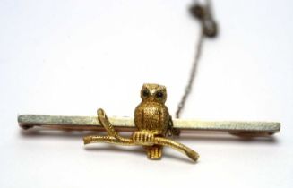 A 9ct yellow gold owl bar brooch