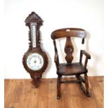 A 20th Century Oak framed wheel aneroid barometer and children's rocking chair