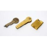 A 9ct gold lighter; 9ct gold key mount; and a silver key mount