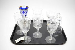 A collection of etched and coloured glassware