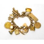 A 15ct yellow charm bracelet with two half sovereign charms and others