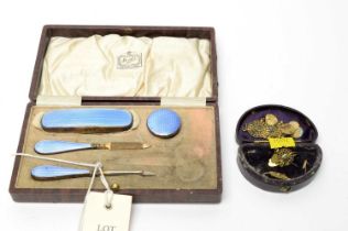 An Art Deco silver and enamel backed manicure set; a pair of earrings; and a pendant
