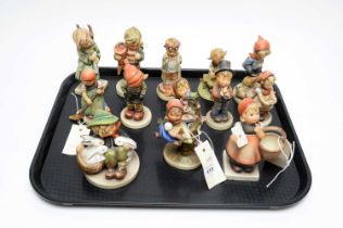 A collection of Hummel figure of children