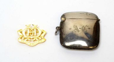 A 9ct gold "Ready and Reliable" school prize badge, and a George V silver vesta case