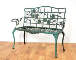A 20th Century metal garden bench painted in a dark green colourway,