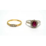 A diamond rings and a ruby and diamond cluster ring