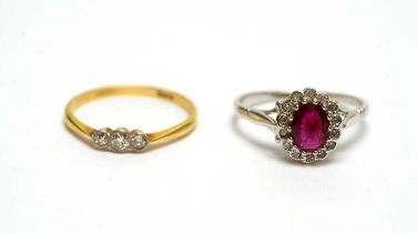 A diamond rings and a ruby and diamond cluster ring