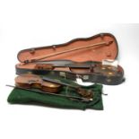 A 19th century walnut violin; and a similar smaller violin
