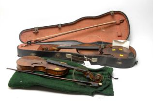 A 19th century walnut violin; and a similar smaller violin