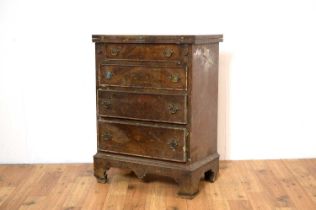 A Georgian-style mahogany bachelor's chest .