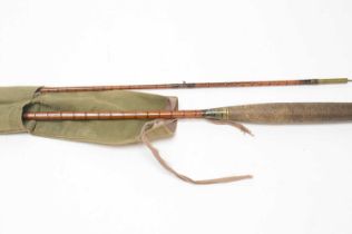 A vintage split cane fishing rod
