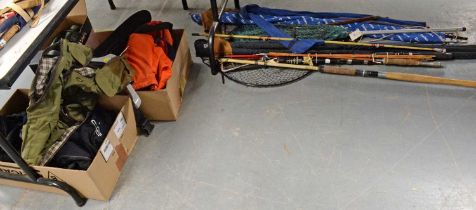 A collection of fishing rods, nets and other items.