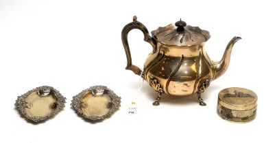 A silver teapot and other items