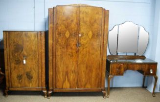 A 1940s burr walnut bedroom suite