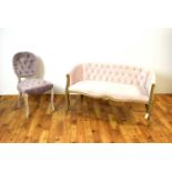A contemporary button back two seater sofa and matching chair