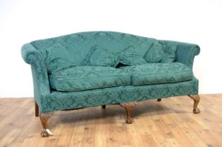 A 20th Century two seater sofa upholstered in green patterned fabric